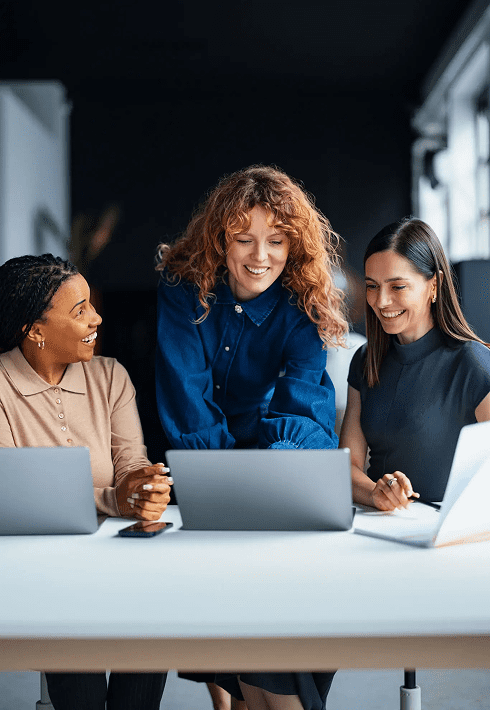 Team discussion around laptops